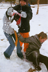 Freshmen Beth Pierce, Jill Hickman, and Cindy Keegan have fun playing in the snow. - Photo by Lindsay Stavish