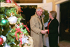First Lady Lanese Dockery welcomes former Union trustee John Dickenson to her home for President's Christmas open house. - Photo by Jim Veneman