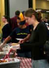 Mary Olson, sophomore teaching English as a second language major, gets her barbeque plate at the lunch provided and prepared by the team at Gwatney Chevrolet.  Gwatney Chevrolet's barbeque placed first at Memphis in May 2005. - Photo by Kristi McMurry