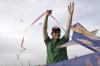 Matt Taylor tries to get a kite up in the air during May Day out on the great lawn by Miller Tower. Besides flying kites, students enjoyed several inflatable play arenas and free snow cones. - Photo by Kyle Kurlick