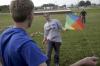 Elisabeth Crecink helps Matt Morse get his kite up in the air during May Day. - Photo by Kyle Kurlick