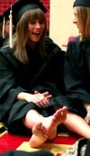 5/17/08 - Allison Hays, public relations/advertising major, and Jessica Ramsay, family studies major, have a laugh in the Fred Delay gymnasium while waiting for graduation to begin. - Kristi McMurry