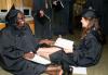 8/2/08 - Organizational leadership graduates, Cassandra Hunt and Angela Tharpe, have a laugh before the graduation ceremony begins. - Kristi McMurry