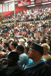 8/2/08 - Ronnie Smith, receiving his masters in Christian studies, and Tracy Brittmon, receiving her doctorate of education, listen to President Dockery's commencement charge about hope at summer graduation. - Kristi McMurry
