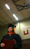8/2/08 - Terri Tibbs, receiving her master of science in nursing, leaves the stage after just receiving her diploma at the summer graduation ceremony. - Kristi McMurry