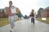 Nursing faculty members Tracy Saddler and Rosemary McLaughlin stuck through the rain and mud to help frehsmen and transfer students move into their new homes.  - Photo by Beth Spain
