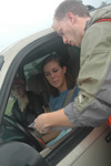 Senior Dustin Mayfield shows the new freshmen where to park during freshmen move-in day.  - Photo by Beth Spain
