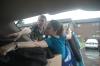 Richard Wells, dean of the chapel, and Erica Tuns, MIR, help unload a freshman car. - Photo by Beth Spain