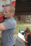 Director of Wellness Services Matt Brunet hoists a mini fridge up the stairs to a new student's room in the Heritage complex during move-in day.  - Photo by Beth Spain