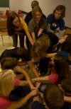 Ellen Kay's FOCUS group tries to untangle themselves from a human knot during a team building exercise. - Photo by Angela Abbamonte