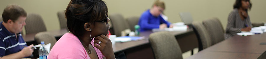 Students listen and take notes in Dr. Rosebrough's class