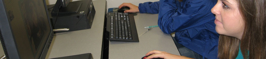 Students work on understanding various technology programs in the education computer lab.