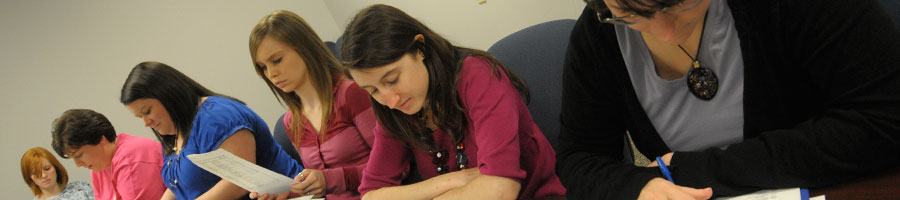 Students take notes and follow along in class.