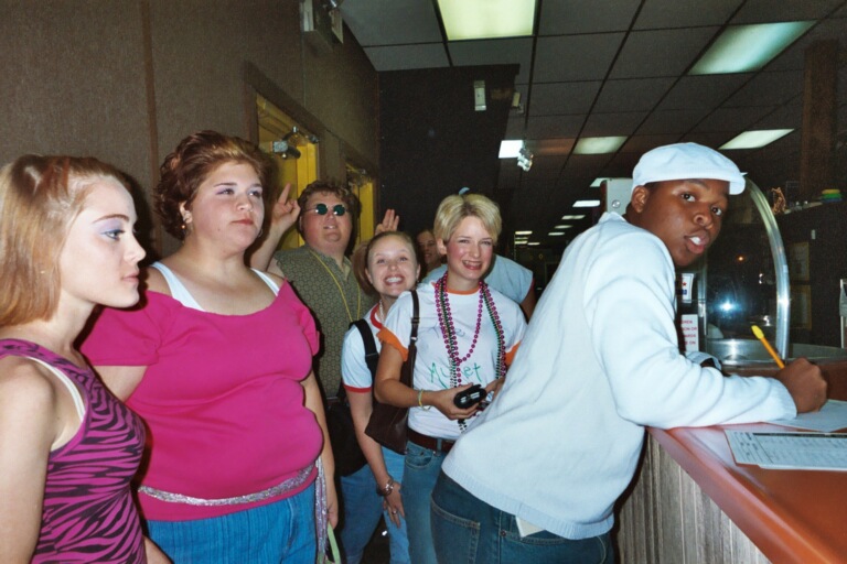 09/5/03 - Freshman Ray Jones and company signs in at 80's skate night.