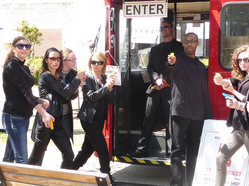 Students from the History of Social Thought spend some time with the Red Bus Project while they are on campus.