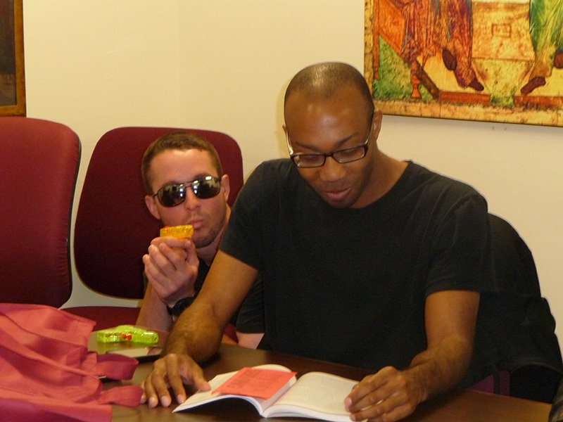 Students Jon Reed and Joshua Morgan participate in a class discussion of Grand Postmodern Theory after dressing up like Matrix characters.