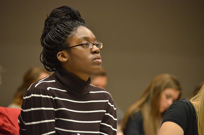 Mary Joseph listens intently as Phil Davignon of Baylor University describes his view on how sociology fits into a Christian worldview.