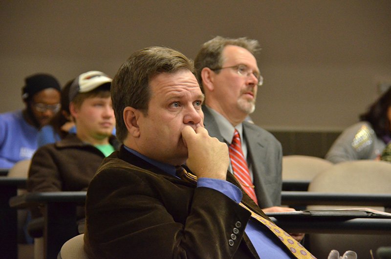 Gene Fant, Executive Vice President for Academic Administration, and John Netland, Dean of the College of Arts and Sciences, listen intently