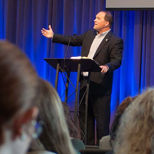 Justin Wainscott preaching in chapel