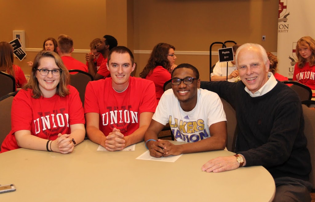 Dr. Stephen Carls (right) sits with incoming history students at the New Students Dinner on August 15, 2015. The students are (left to right) Laura Beth Russell, Andrew Caldwell, and Cedric Davis.