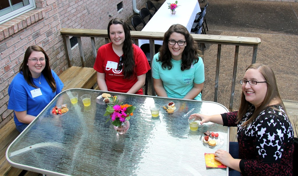 Attendees at the History Welcome Reception on August 31, 2015, pause for a photo. They are (left to right) Kathryn Mitchell, Lauren Geary, Livvy Winters, and Hannah Conway.