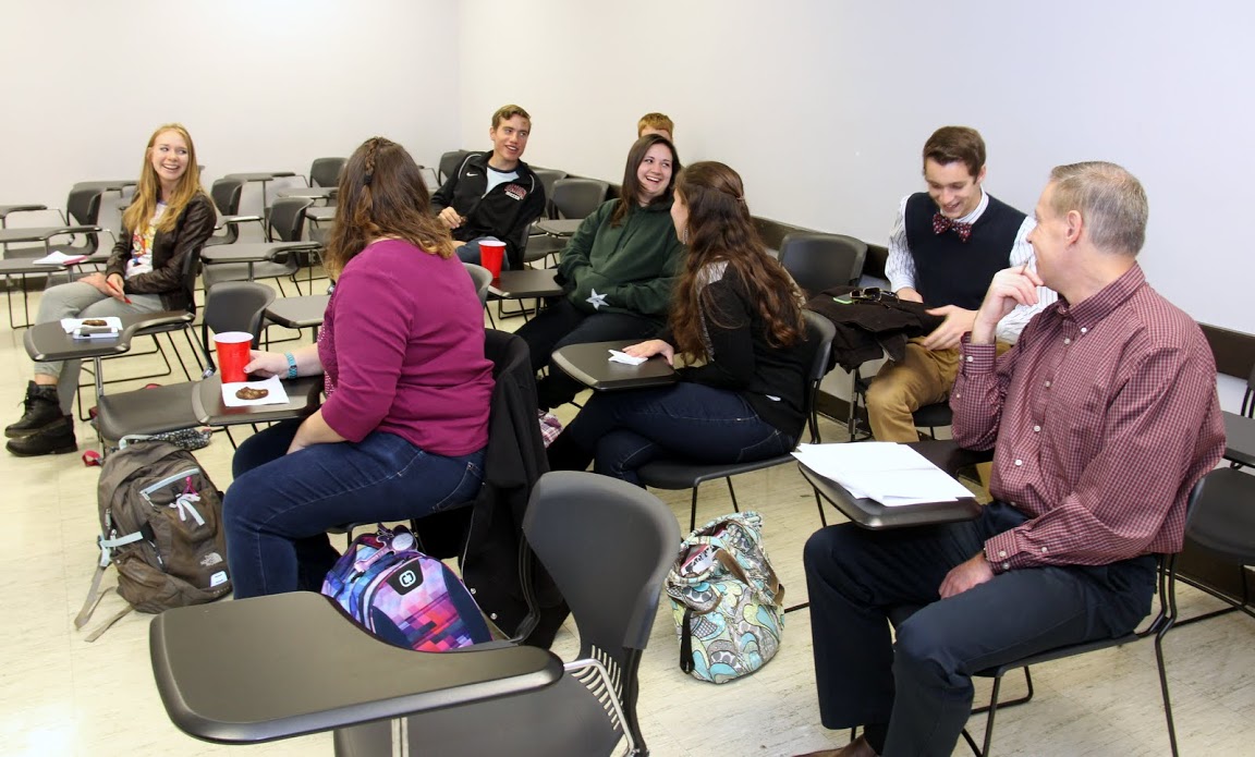 History club members smile as Jonathan Greer (back row on right) gets up to take the club's membership oath on October 19, 2015.