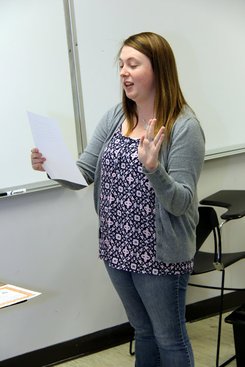 Rutledge Honorary History Club President Kathryn Mitchell conducts the membership oath for Jonathan Greer on October 19, 2015.