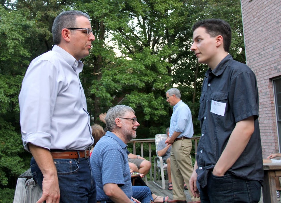 Dr. Keith Bates (left front) talks to history major Nic Linn at the History Welcome Reception on August 29, 2016.