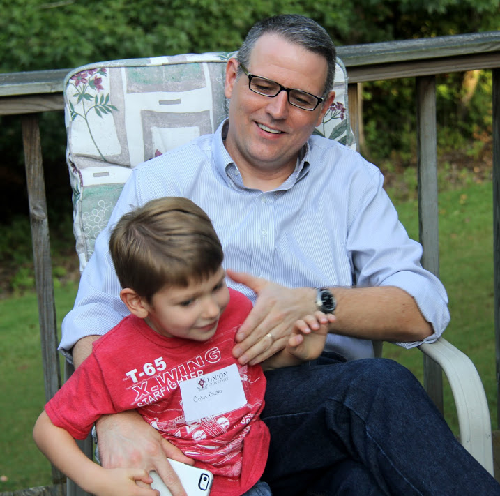 Dr. Keith Bates enjoys a moment with his son Colin at the History Welcome Reception on August 29, 2016.