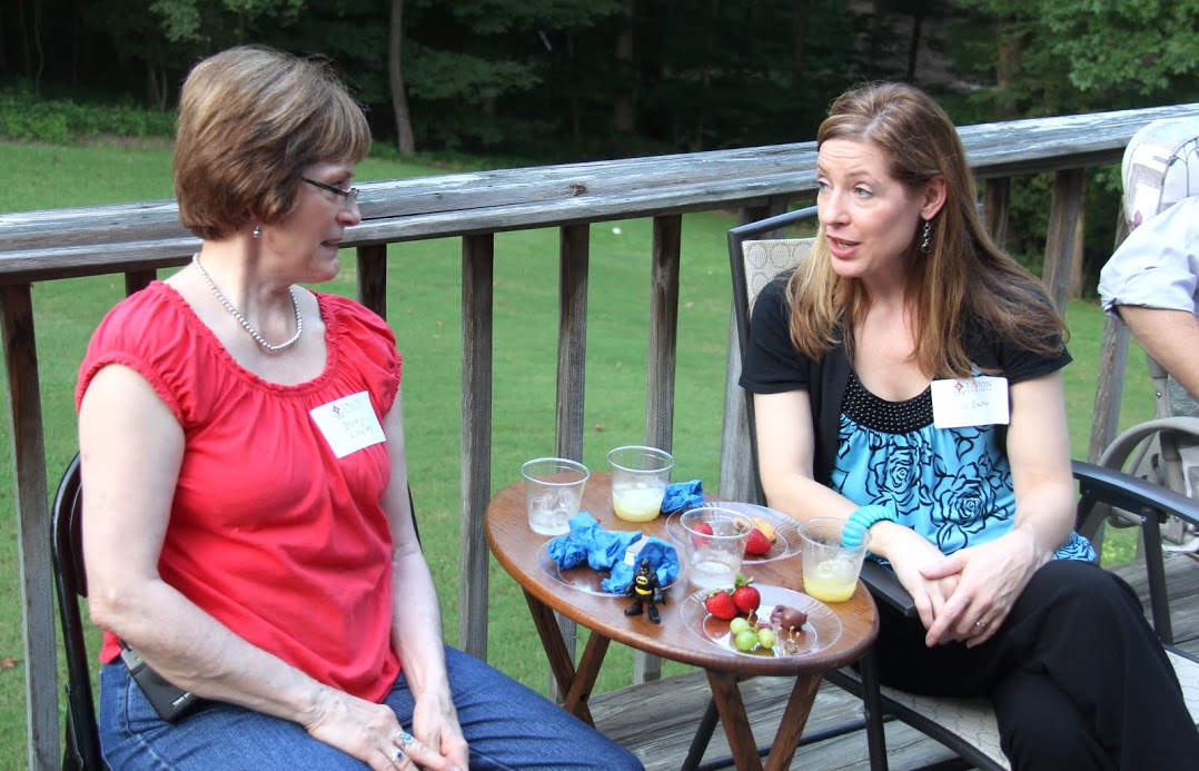 Becky Lindley (left) and Lisa Bates converse at the History Welcome Reception on August 29, 2016.