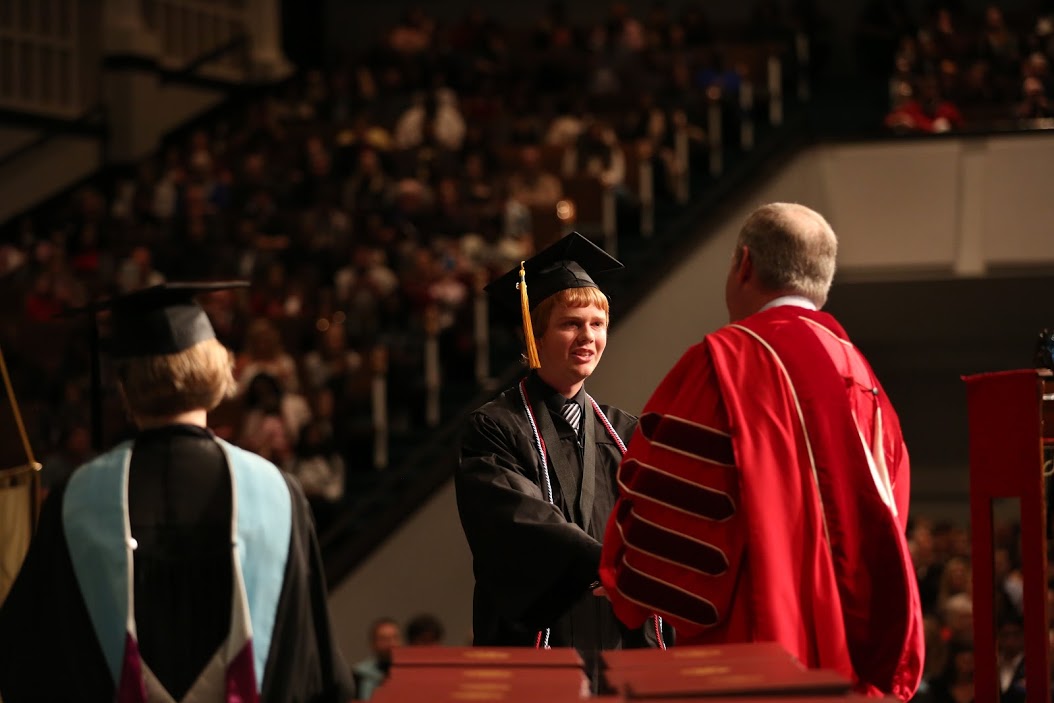 History major Gideon Ragland accepts congratulations from Dr. Samuel W. Dub Oliver while receiving his bachelor of science degree at Union's fall commencement exercises on December 17, 2016. Photo by Kristi Woody