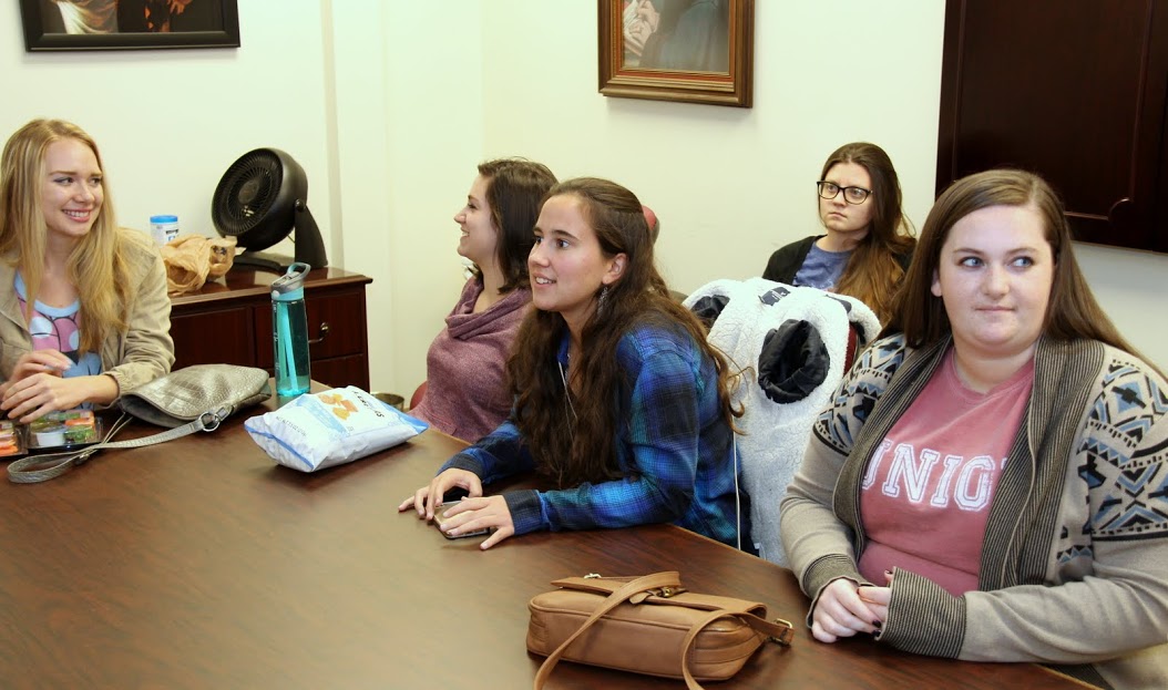 History club members Ali Renckens (left to right), Lydia Black, Joanna Butcher, Emily Summers, and Sarah Burdick enjoy themselves at the beginning of the club's movie night on December 2, 2016.