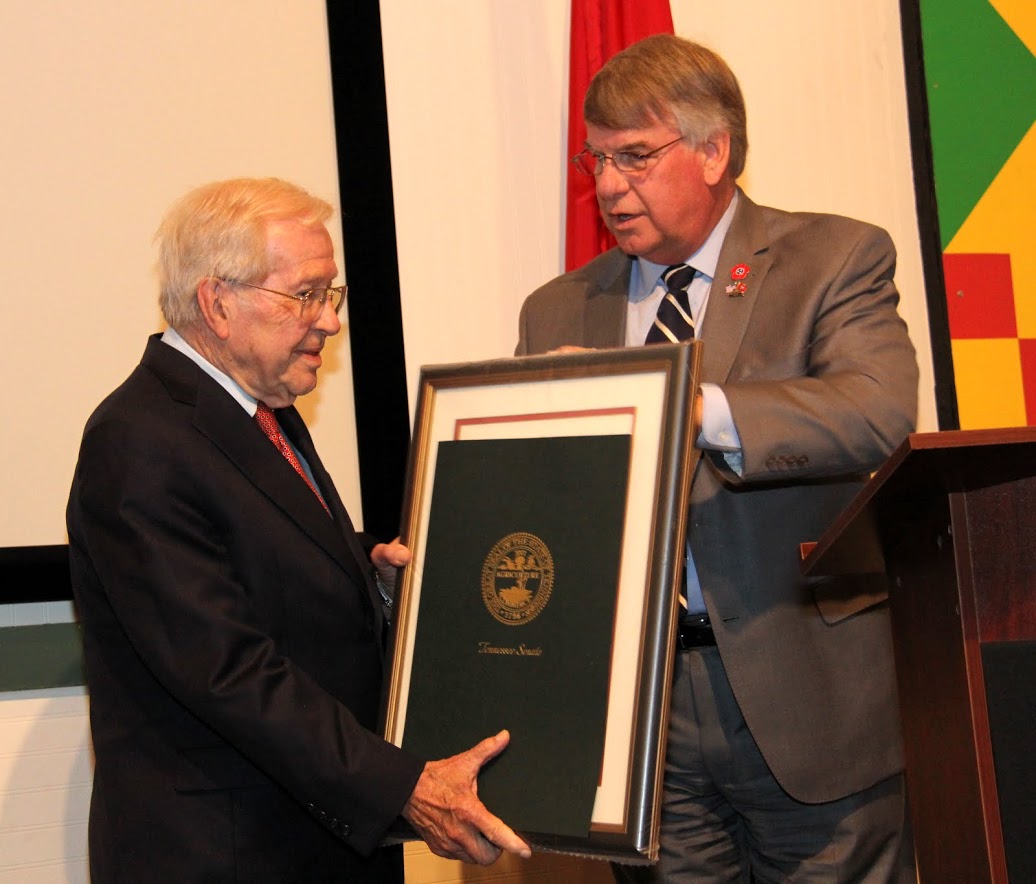 Tennessee State Senator Ed Jackson (right) makes a special presentation to Dr. Charles Crawford, Professor of History at the University of Memphis, for Crawford’s many years of dedicated service as a teacher and scholar of Tennessee history and as Director of the Oral History Research Office at his university.