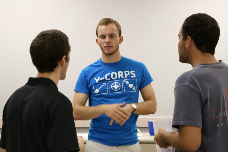 Seth Reid (facing camera) talks to Luke Adkins (left) and Jeremy Ebert following the Phi Alpha Theta plenary meeting on September 13, 2016. Photo by Elizabeth Wilson
