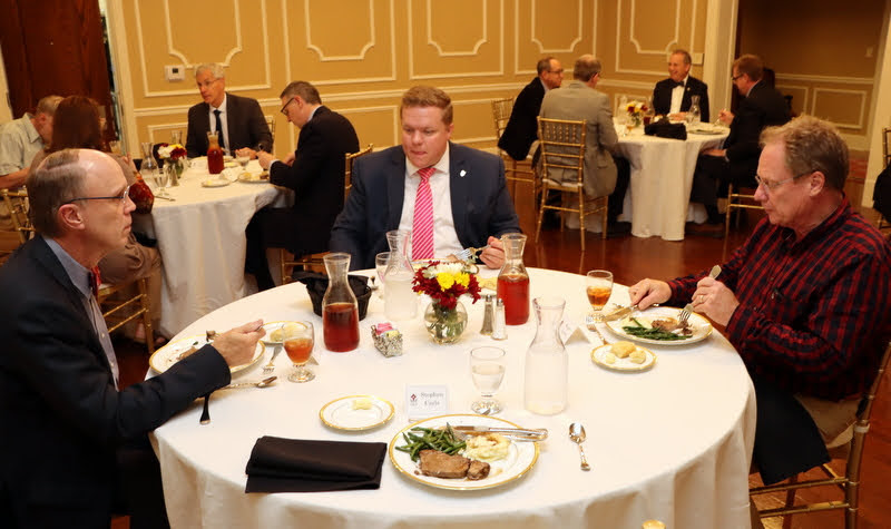 Attendees at a dinner in honor of Dr. David Bell enjoy their meals in Union's Chapman Dining Room on October 25, 2021. At the front table in the photo are (left to right) Robert Briley, Colby Benefield, and Shane Lynch.