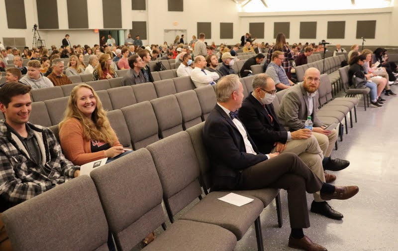 An audience of some 500 people gathers on the evening of October 25, 2021, to hear Dr. David Bell of Princeton University speak about 