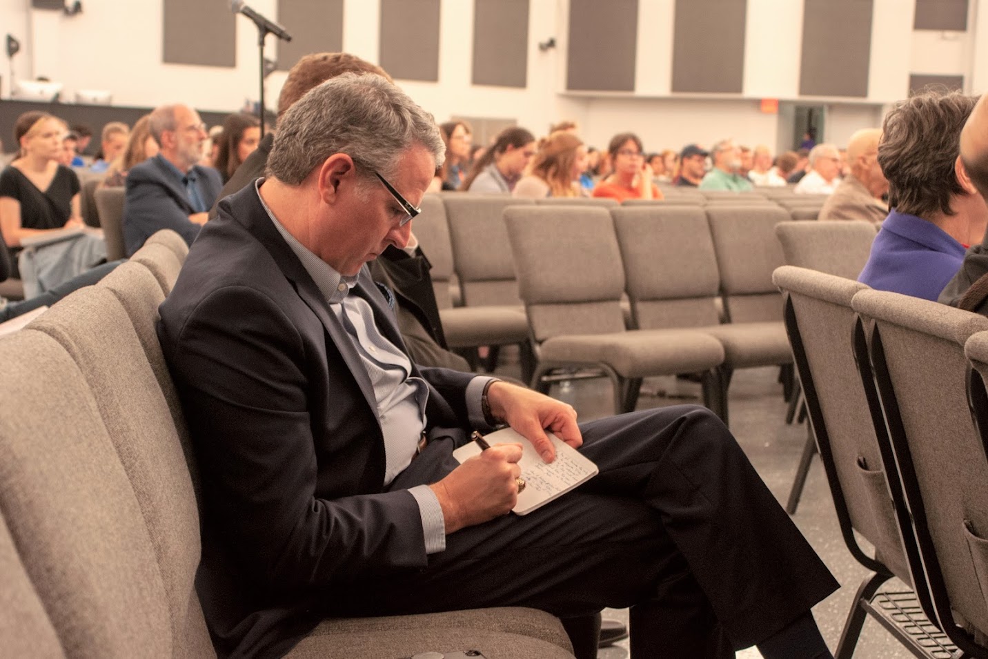 Dr. Keith Bates takes notes during Dr. Michael Neiberg's evening lecture on Perilous Times: America's Search for Security after the Fall of France in World War II on October 24, 2022. Photo by Lauren Steed.