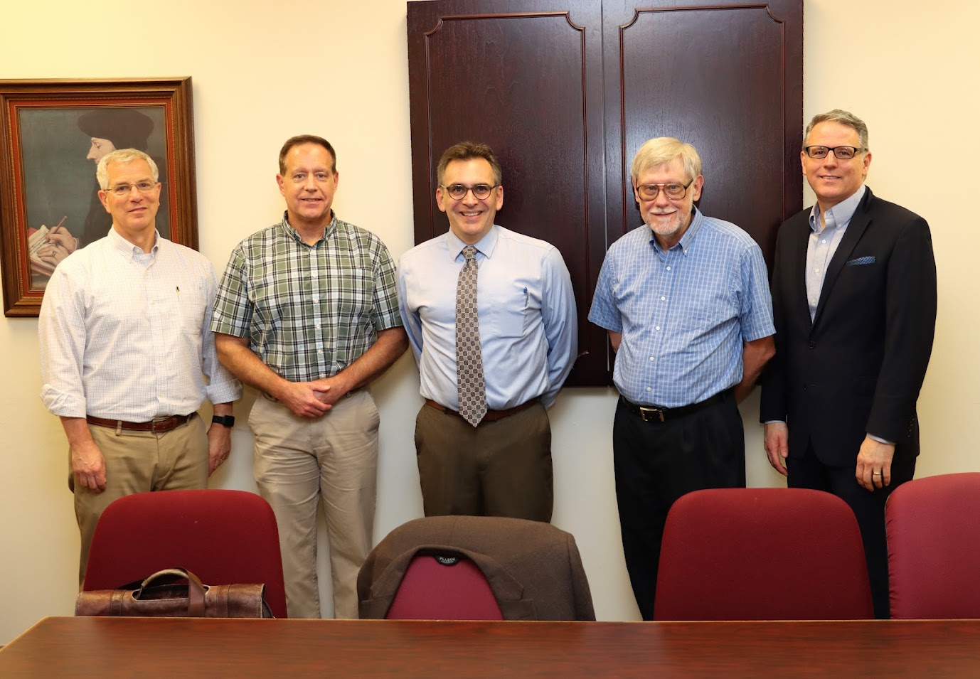 Dr. Michael Neiberg (center) joins history department members for a photo during their coffee time on October 24, 2022. The faculty members are (left to right) Drs. David Thomas, Henry Allen, Terry Lindley, and Keith Bates.