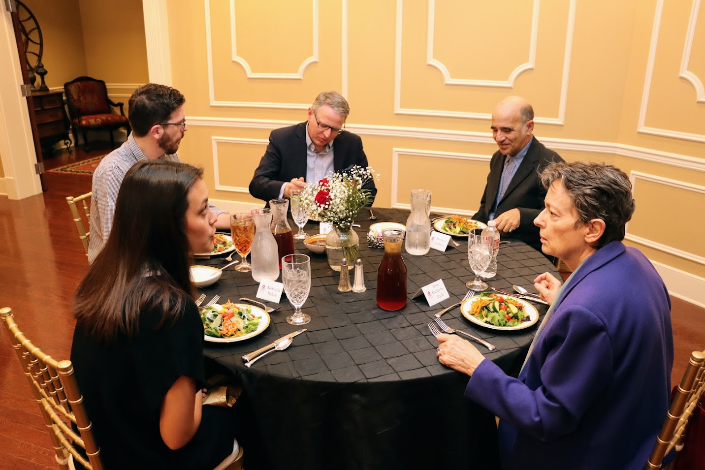 Attendees at a dinner in honor of Dr. Michael Neiberg, the 2022 Carls-Schwerdfeger History Lecturer, enjoy conversation with each other on October 24. They are (starting at 9 o'clock and going clockwise) Logan Smith, Dr. Keith Bates, Dr. Michael LaRosa, Dr. Alice-Catherine Carls, and Makayla Baker.