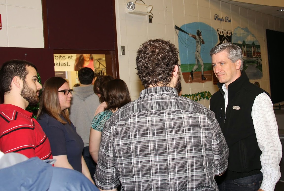 Lowe Finney (right), a candidate for the office of Mayor of Jackson, talks to Union students at the Jackson Old Hickory Rotary Club Pancake Breakfast on March 14, 2015.
