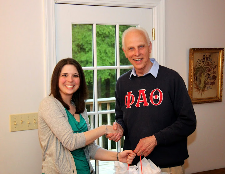 Phi Alpha Theta member Caitlin Roach accepts congratulations from Dr. Stephen Carls at the 23rd annual history department cookout on May 8, 2015, for the successful completion of her MBA at Union University in May, 2015.
