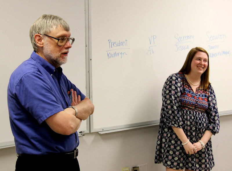 Dr. Terry Lindley provides some guidance during the election of the Rutledge Honorary History Club officers for 2016-2017 at the club's meeting on April 5, 2016. On the left is Club President Kathryn Mitchell.