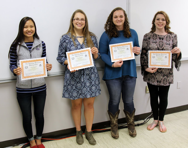 Newly initiated Rutledge Honorary History Club members proudly hold their certificates of membership at the club's plenary meeting on April 5, 2016. They are: (left to right) Katherine Cheshire, Madison Hutcherson, Samantha Daily, and Karina Bogard.