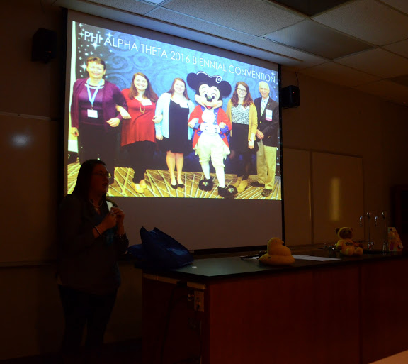 Kathryn Mitchell talks about the trip that a group of Delta-Psi chapter members took to the 2016 Phi Alpha Theta Biennial Convention in Orlando, Florida, on January 6-10 during the chapter's spring plenary meeting on February 22, 2016. Photo by Elizabeth Wilson