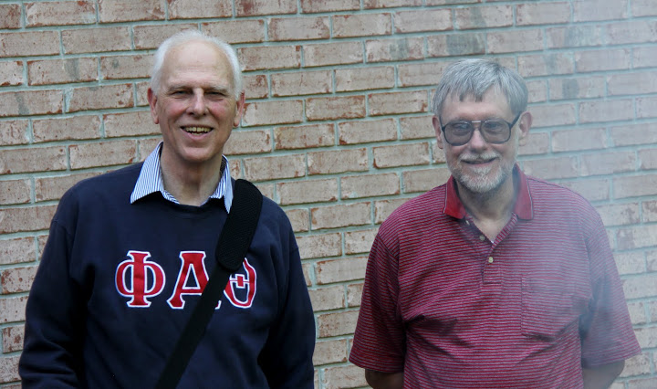 Drs. Stephen Carls (left) and Terry Lindley take time for a photo during the grilling of hamburgers and hot dogs at the history department cookout on May 13, 2016.