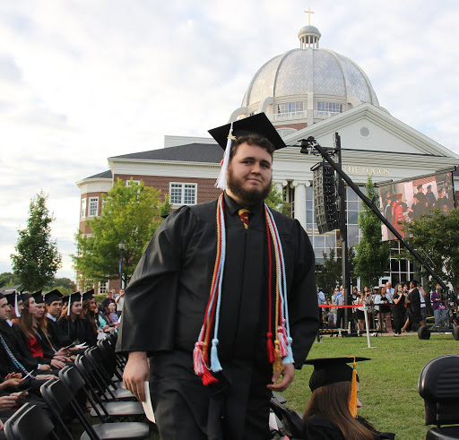 History major Nicholas Hancock walks toward the dais to receive his bachelor's degree on May 21, 2016.