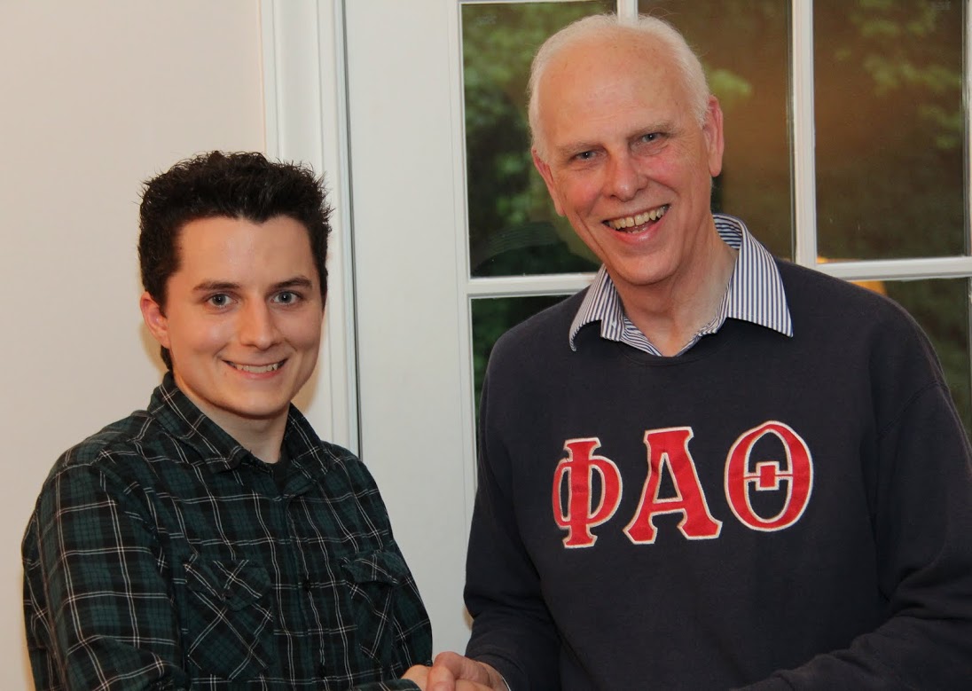 Nic Linn (left) accepts congratulations from Dr. Stephen Carls at the history department cookout on May 12, 2017, for his completion of a bachelor of arts program at Union University.