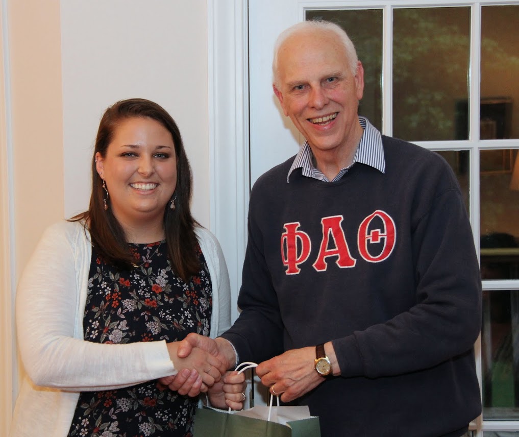 Graduating senior Emily Littleton accepts congratulations from Dr. Stephen Carls at the Phi Alpha Theta cookout on May 12, 2017, for her completion of a bachelor of arts program in history and journalism at Union University.