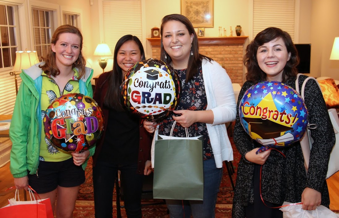 Three graduating Phi Alpha Theta members hold balloons of congratulations at the Phi Alpha Theta/History Department Cookout on May 12, 2017. Those in the photo are (left to right) Beth Adams, Katherine Cheshire, Emily Littleton, and Priscilla Porter.