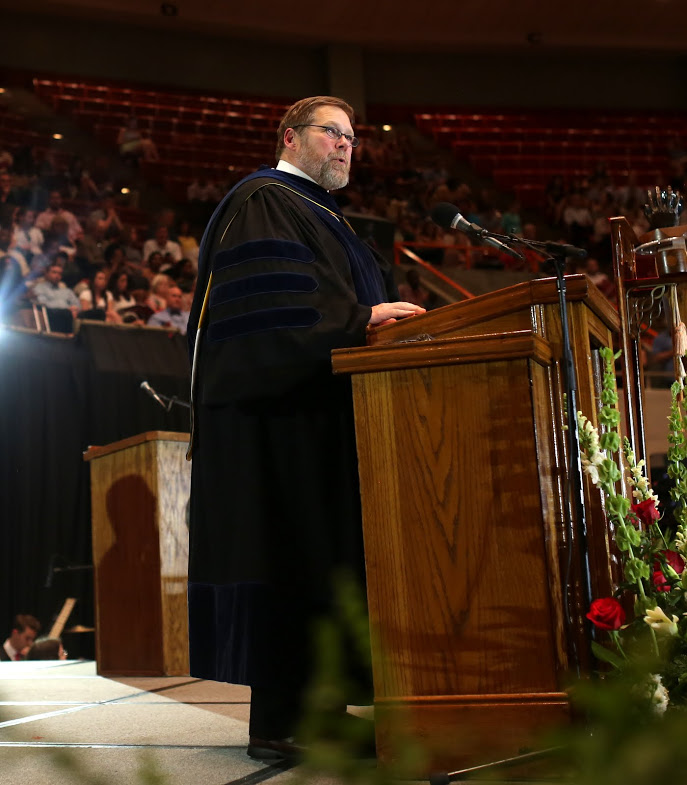 Dr. Ben Mitchell, the Union University provost, prepares to announce the winner of the 2017 Tigrett Medal at the end of the school's undergraduate commencement services on May 20, 2017. Photo by Kristi Woody